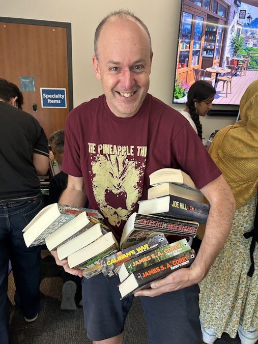 Person holding books.