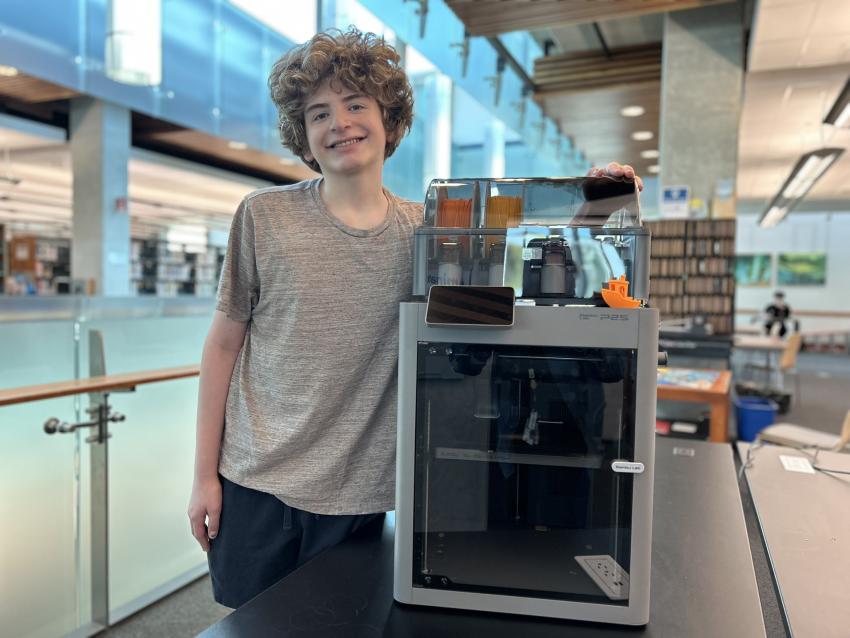 Person Next to 3D Printer