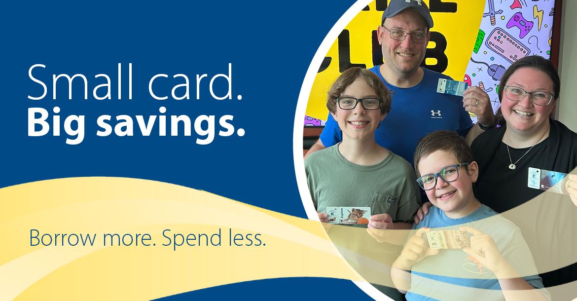 Smiling family holding library cards